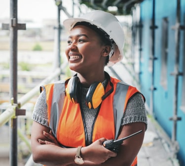 Smiling female construction worker