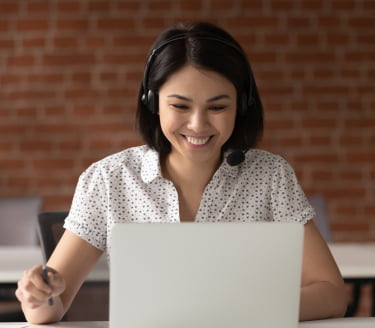 Female receptionist using laptop