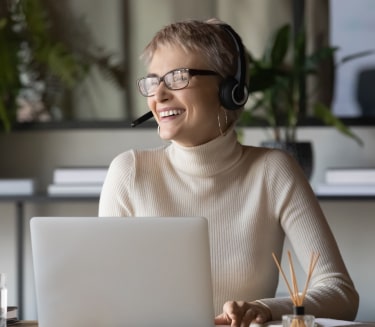 Receptionist answering call over headphone